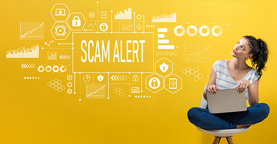 Scam alert with woman using a laptop