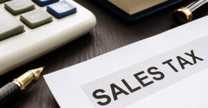 Sales tax. Papers on the office table.
