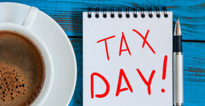 The inscription Tax Day on the note like Notification of the need to file tax returns, tax form